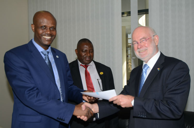 EAC Secretary General; Amb. Liberat Mfumukeko (left) receives credentials from the Netherlands Ambassador to the United Republic of Tanzania and the EAC, H. E Amb Jeroen Verheul (right) at the EAC Headquarters in Arusha, Tanzania. 