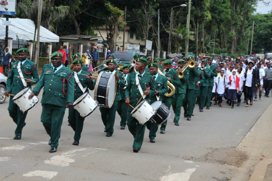 The Monduli Military Academy Brass Band leads the procession to mark the EAC 20th Anniversary through the streets of Arusha.