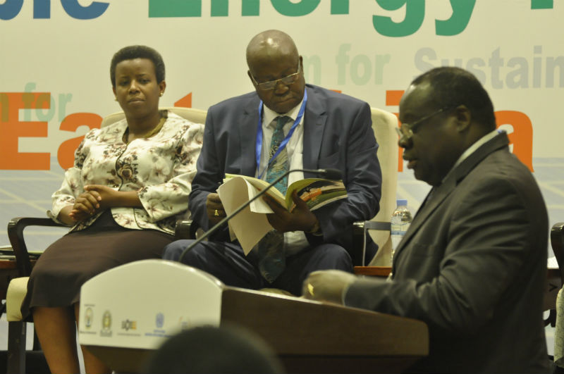 EAC Deputy Secretary General, in charge of Productive and Social Sectors, Hon. Christophe Bazivamo delivers his remarks during the opening of the Forum. Looking on are State Minister of Infrastructure Rwanda, Hon. Germaine Kamayirese and Minister of State for Energy Uganda, Hon. Simon D'Ujanga.