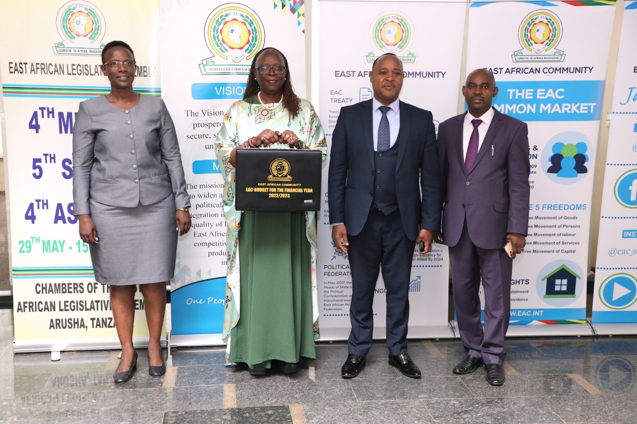 The Chairperson of the EAC Council of Ministers, Hon. Betty C. Maina (holding budget briefcase), with EAC Secretary General, Hon. (Dr.) Peter Mathuki (second right) and other EAC officials before the Cabinet Secretary tabled the EAC 2022/2023 budget estimates before the East African Legislative Assembly in Arusha, Tanzania. 