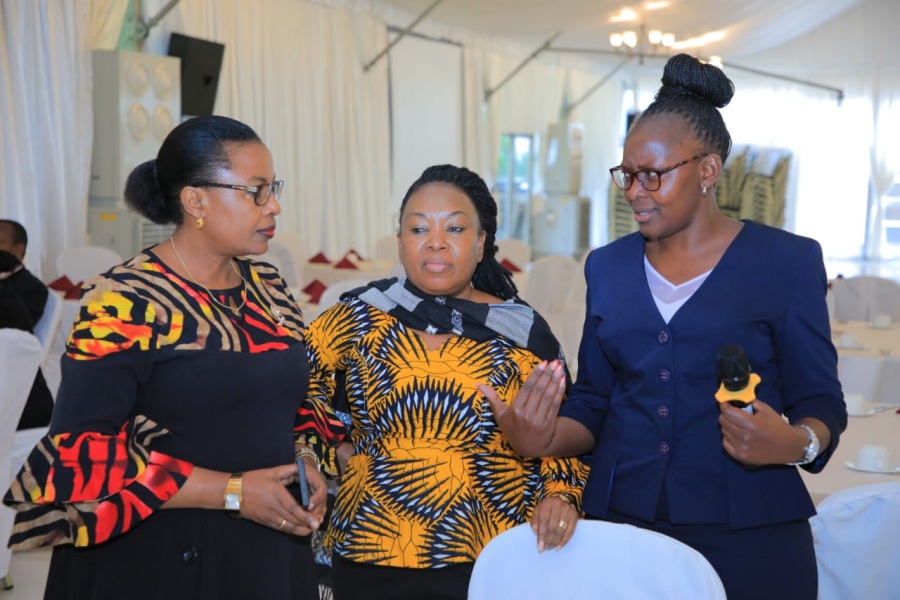 The Director of Human Resource and Administration at the EAC Secretariat, Ms. Ruth Simba (centre), confers with the Director Social Sectors, Dr. Irene Isaka (left), and the Principal Human Resource Officer, Ms. Grace Odongo, during the induction workshop for new EAC staff.