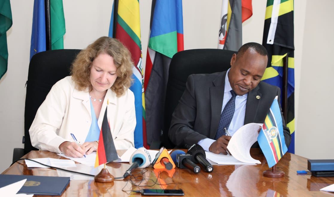 EAC Secretary General Hon (Dr.) Peter Mathuki and the Head of the German Delegation, Ms. Claudia Imwolde-Kraemer, from the German Federal Ministry for Economic Cooperation and Development sign the summary record of the EAC- German Government negotiations.