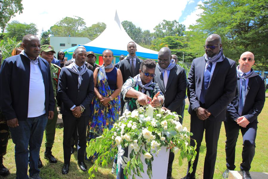 Arusha District Commissioner, Hon Emmanuela Kaganda lights a candle to commemorate the Genocide Against Tutsi