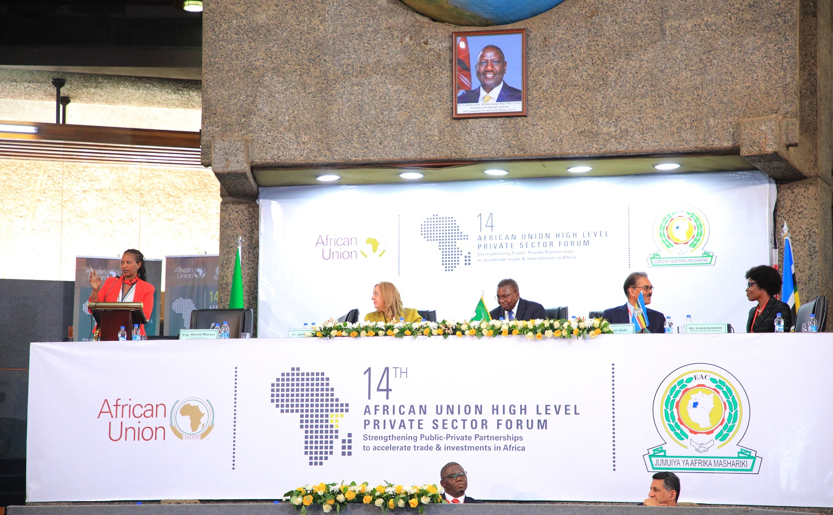 The Acting Director of Customs and Trade, Ms. Flavia Busingye (left), before the launch of the One Stop Border Post Performance Measurement Tool at the 14th High Level African Union Private Sector Forum in Nairobi. On the high table are dignitaries who attended the forum.