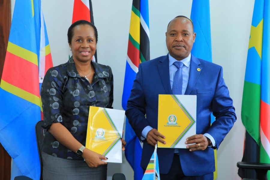 (Right); EAC Secretary General Hon. (Dr.) Peter Mathuki and (right) the UNHCR Regional Director for the East, Horn and Great Lakes Regions, Ms. Clementine Nkweta-Salami signing the MOU at the EAC Headquarters in Arusha, Tanzania.    