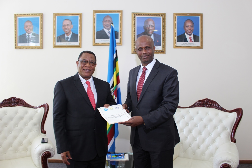 Secretary General of COMESA, Mr Sindiso Ndema Ngwenya receives report of Tripartite Task Force (TTF) from EAC Secretary General, Amb. Liberat Mfumukeko