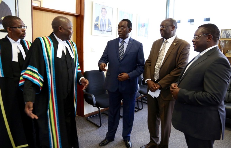 The EALA Clerk, Mr Kenneth Madete (left) shares a light moment with the President of Senate, Rt Hon Bernard Makuza, Speaker of the Transitional National Legislative Assembly of South Sudan, Rt Hon Anthony Lino Makana and the Speaker, Senate of Kenya, Rt Hon Kenneth Lusaka in Arusha