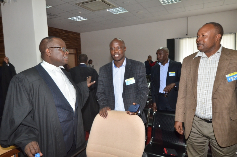 The Applicant Prof Paul Kiprono Chepkwony talking to his Lawyer, Mr Joel Kimutai,  after the Ruling