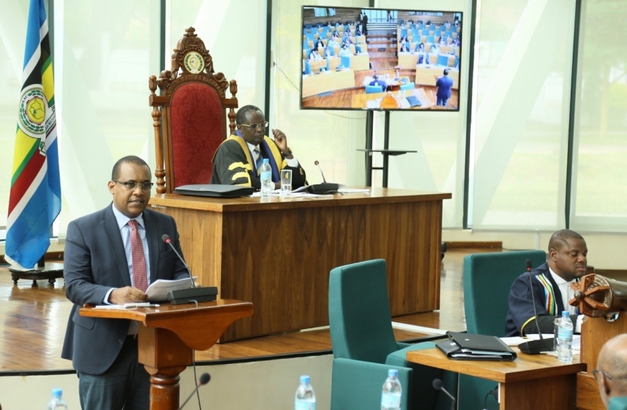 Hon Abdikadir Aden, Chairman of the General Purpose Committee presents the report of the Committee on the petition received from EACSOF