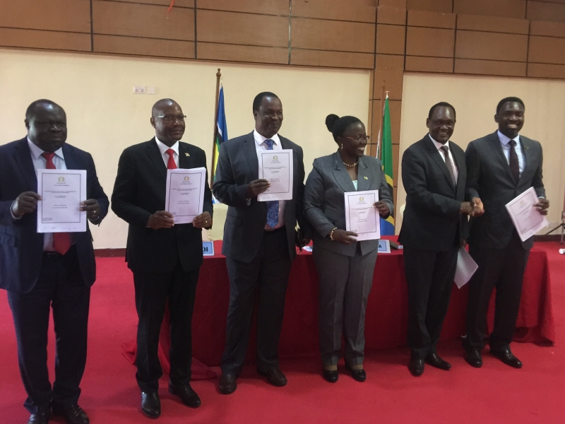 Rwanda’s Minister of Environment and Chairperson of the 7th EAC Sectoral Council of Ministers on Environment and Natural Resources, Dr. Jeanne d’Arc Mujawamariya (third right), and other officials hold the report of the meeting. Also in the photo are (from left) Hon. Christophe Bazivamo (EAC Deputy Secretary General in charge of Productive and Social Sectors), Dr. Deo Rurema (Burundi’s Minister for Environment, Agriculture and Livestock); Mr. Sam Cheptoris (Uganda’s Minister for Water and Environment);; Dr. Chris Kiptoo (Kenya’s Principal Secretary for Environment and Forestry), and; Dr. Hamisi Kigwangalla (Minister for Natural Resources and Tourism, Tanzania).