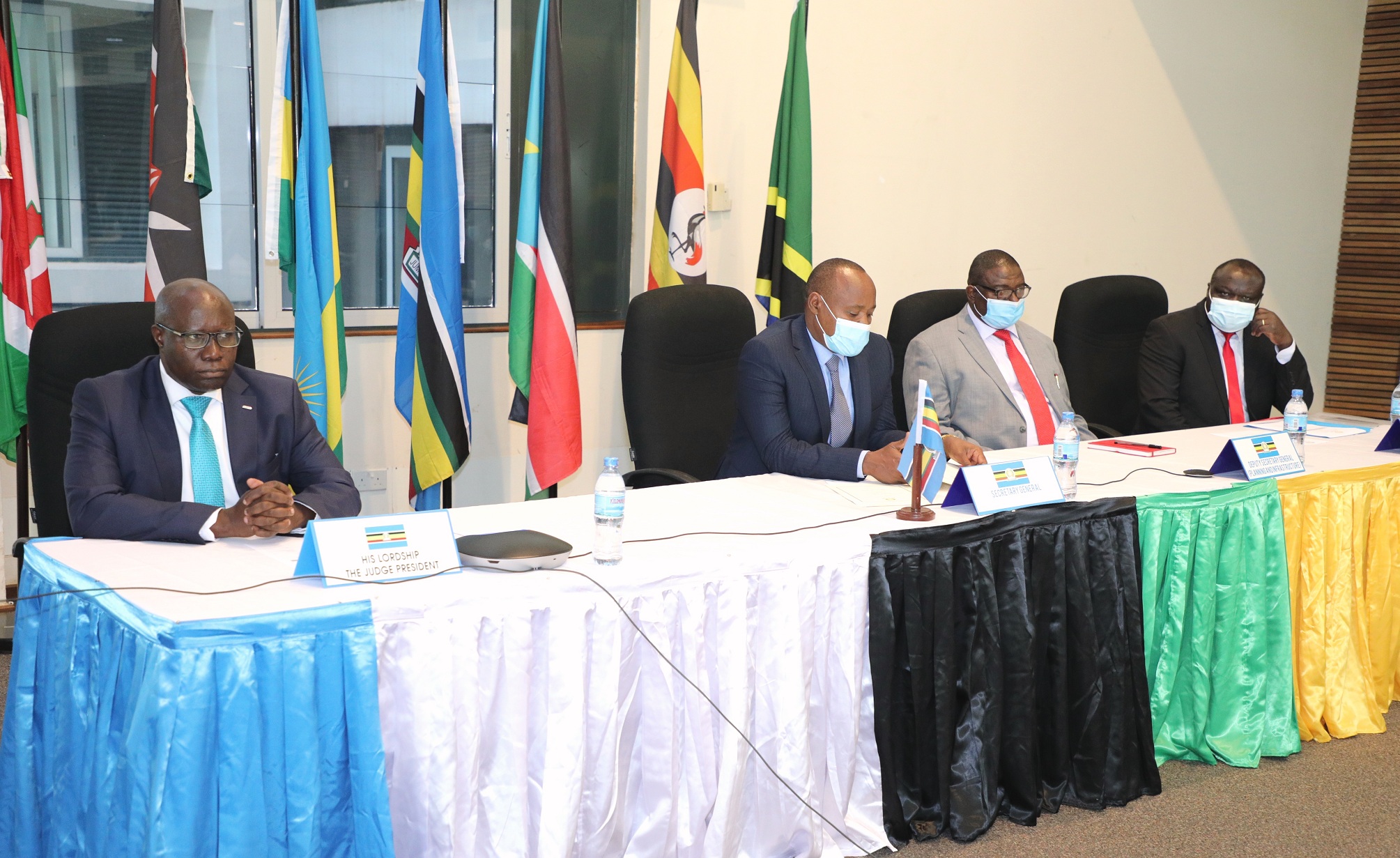  EAC Secretary General Hon. (Dr.) Peter Mathuki (second left) during the SG’s New Year Address to Staff of EAC Organs and Institutions. With him are (from left) the Judge President of the East African Court of Justice, Justice Nestor Kayobera, the EAC Deputy Secretary in charge of Planning, Infrastructure, & Finance and Administration, Eng. Steven Mlote, and the Deputy Secretary General - Productive and Social Sectors, Hon. Christophe Bazivamo.