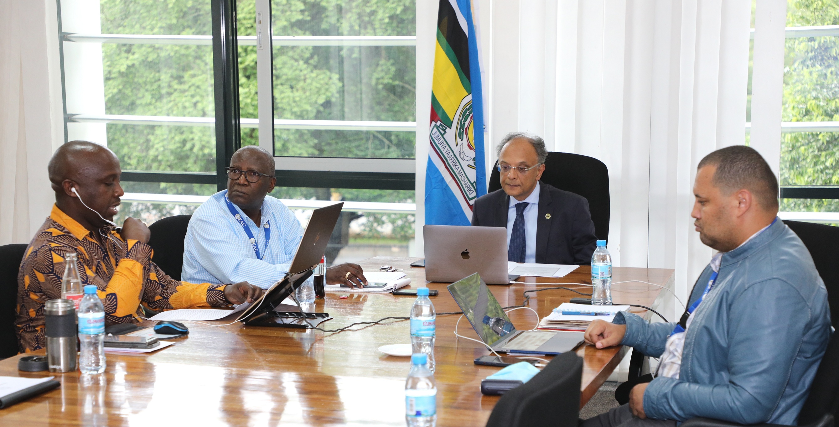 Kenya’s Permanent Secretary for EAC, Dr. Kevit Desai (second left) with EAC Secretariat officials (from left) Mr. Donald Tindamanyire, Mr. Geoffrey Osoro and Mr. Anthony Minja. 
