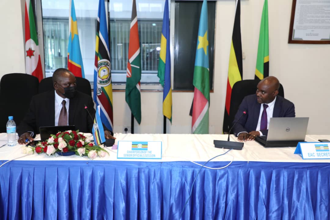 EAC Director of Finance Mr. Juvenal Ndimurirwo( R) makes his remarks as the Chairperson of the Session of the Senior Officials Mr. Raphael Kanothi looks on