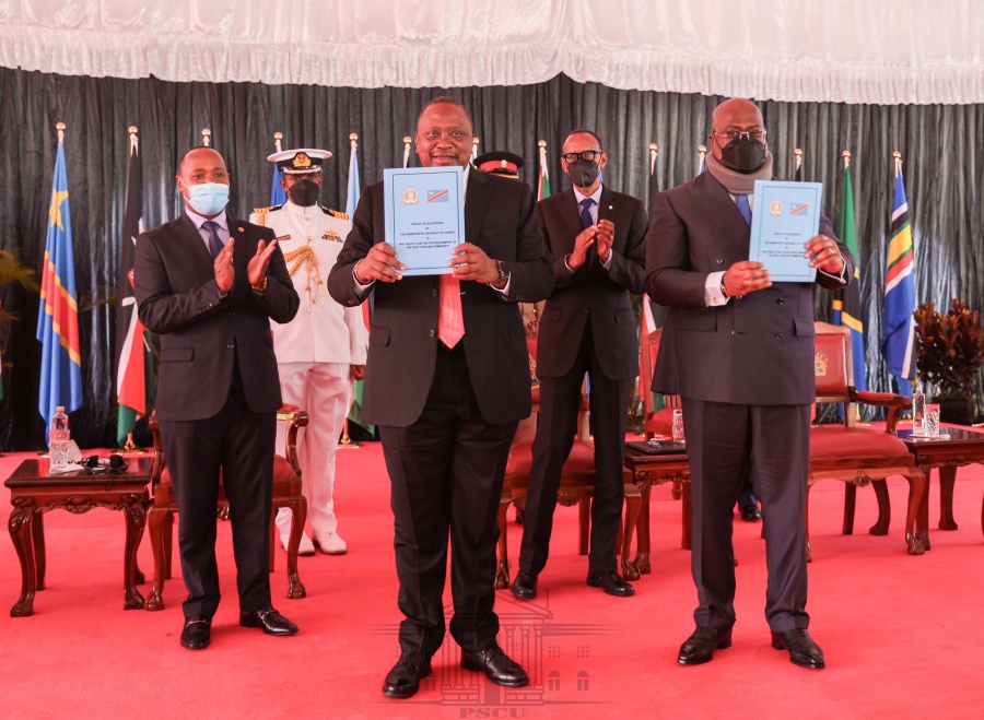 The Chairperson of the Summit of EAC Heads of State, H.E. President Uhuru Kenyatta (left) and the President of the Democratic Republic of the Congo, H.E. Félix-Antoine Tshisekedi Tshilombo, with the Treaty of Accession by DRC to the EAC after signing the Treaty at State House, Nairobi, Kenya. 