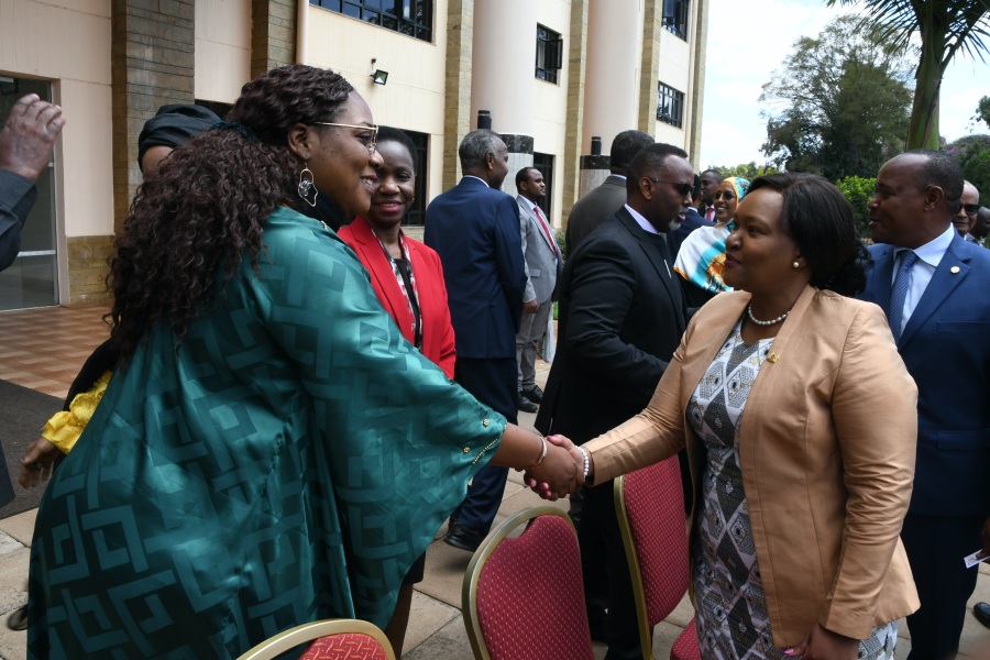 Kenya’s Cabinet Secretary for East African Community, ASALs and Regional Development, Hon. Rebecca Miano (second right), with a delegate after she officially opened the negotiations between EAC and Somalia for the latter’s entry into the EAC at the Kenya School of Government Main Campus in Lower Kabete, Nairobi. On the left is EAC Secretary General Hon. (Dr.) Peter Mathuki.