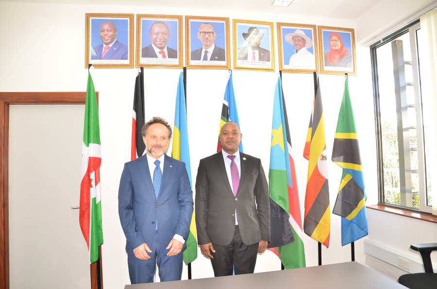 EAC Secretary General Hon. (Dr.) Peter Mathuki (right) confers with the Head of the ICRC Regional Delegation, Mr. Olivier Dubois, at the EAC Headquarters in Arusha, Tanzania. Seated left is Mr. Barako Elema, ICRC Humanitarian Adviser. 