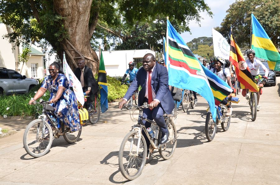 The EAC Deputy Secretary General in charge of the Productive and Social Sectors, Hon. Christophe Bazivamo enjoys a bicycle ride during the flagging off of the Great African Safari 